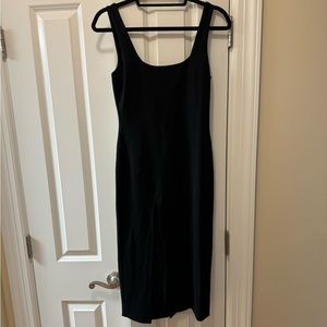Brand New! Never Worn! Black slit midi dress. Size S.